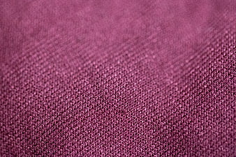 Close-up of textured maroon fabric weave pattern