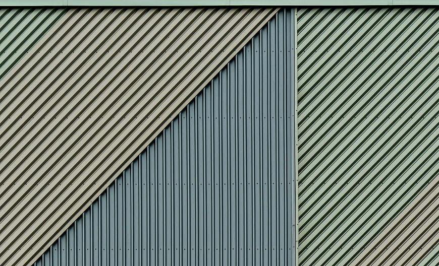 Abstract geometric pattern of corrugated metal siding