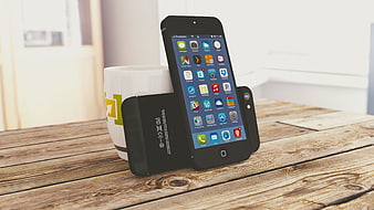 Black smartphones and coffee mug on rustic wooden table