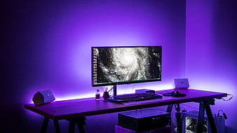 Modern Gaming Desk Setup with Purple LED Lighting