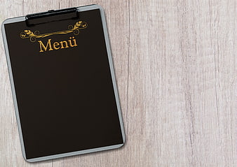 Black Menu Clipboard on Wooden Table with Copy Space