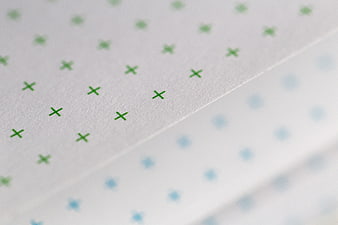 Close-up of Green Cross Pattern on Textured Paper