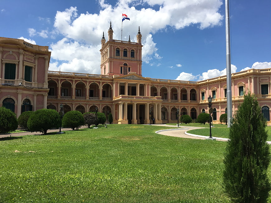 Palacio de los López in Asunción, Paraguay with manicured gardens and blue sky