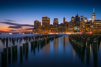 Manhattan skyline at dusk with long exposure water reflections