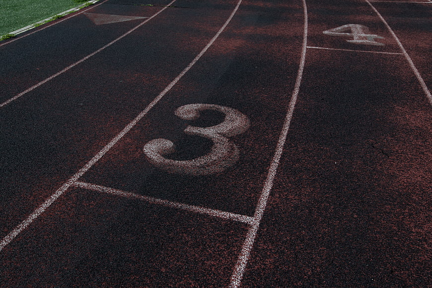 Close-up of Number 3 on Red Running Track Lane