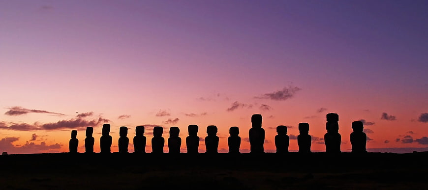 Panoramic Silhouette of Moai Statues at Sunset
