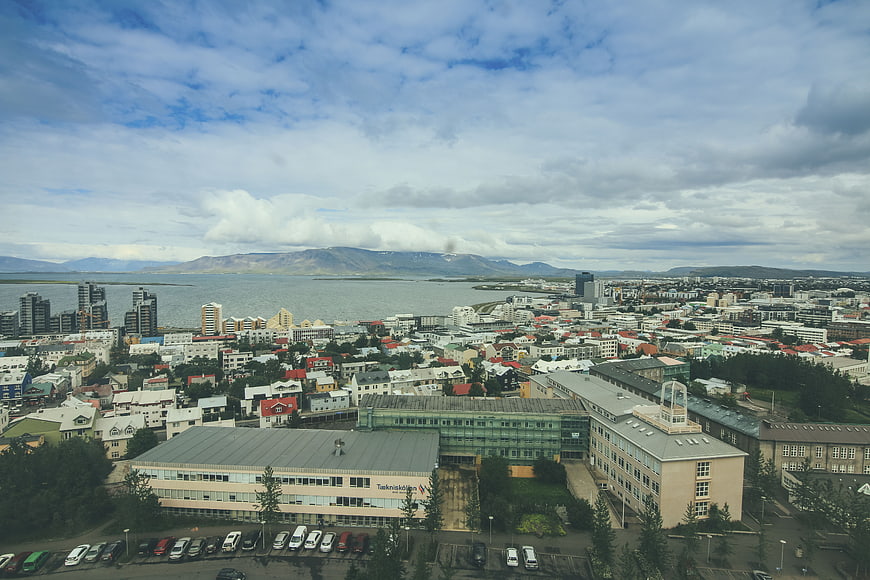 Aerial View of Reykjavik Cityscape with Harbor and Mountains