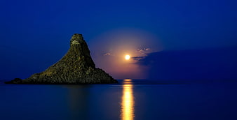 Rock Formation on Sea during Dawn