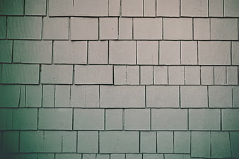 Textured Green and White Brick Wall Background