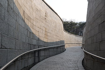 Curved stone pathway in Namsan Hanok Village, Seoul