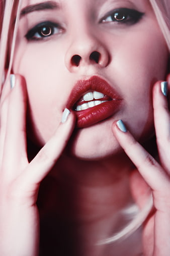 Sensual Close-Up Portrait of Woman with Red Lips and Blue Nails