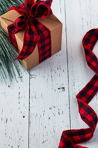 Rustic Christmas Gift Box with Buffalo Plaid Ribbon on White Wood