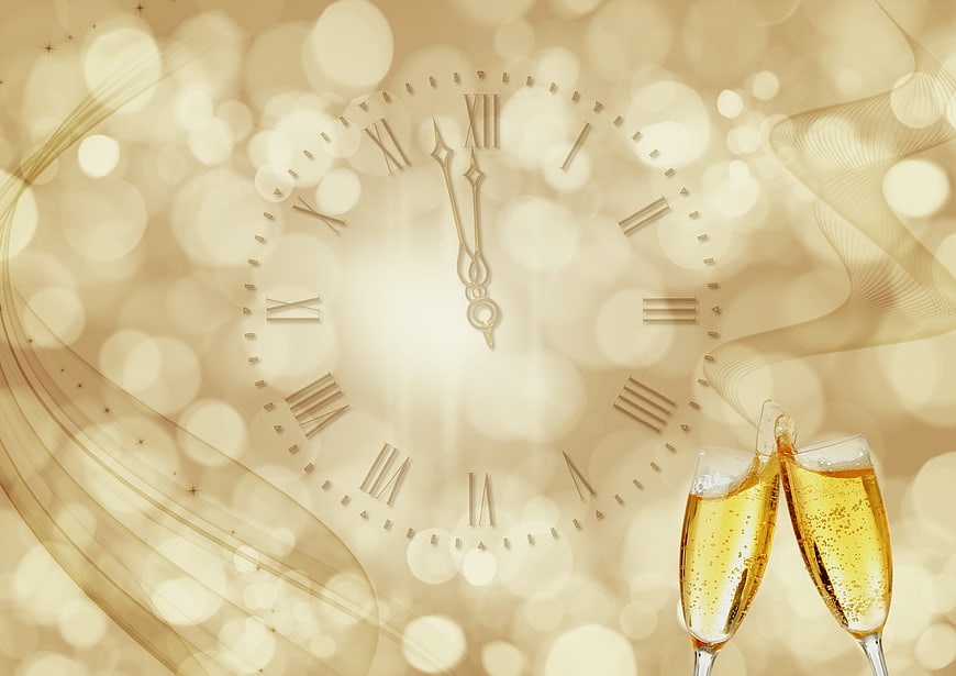 Champagne Glasses and Clock Face on Golden Bokeh Background