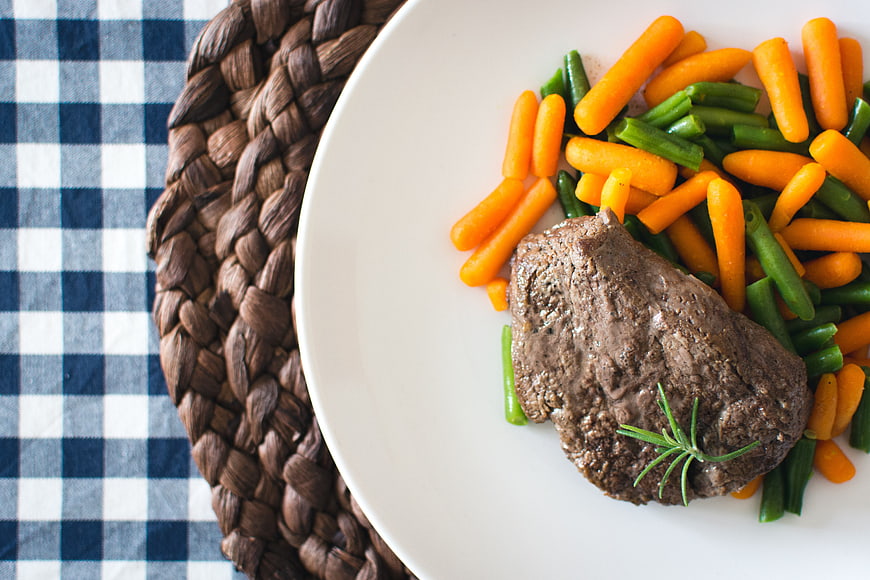 Top View of Grilled Steak with Carrots and Green Beans