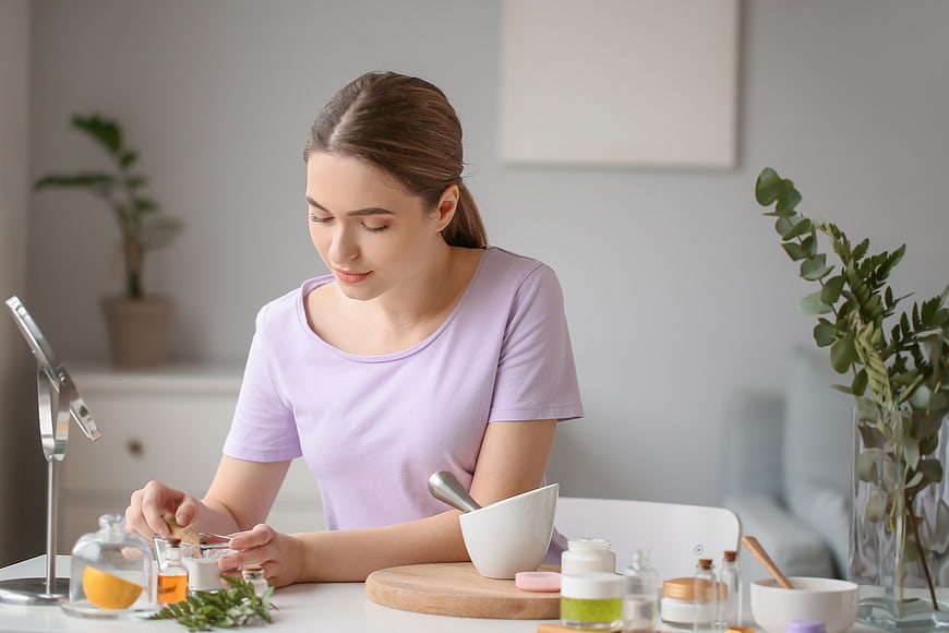 Woman making natural homemade cosmetics at home
