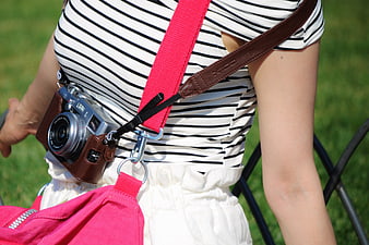 Woman with Vintage Camera and Pink Bag