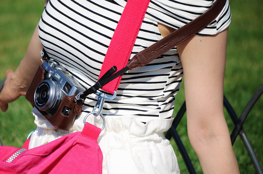 Woman with Vintage Camera and Pink Bag