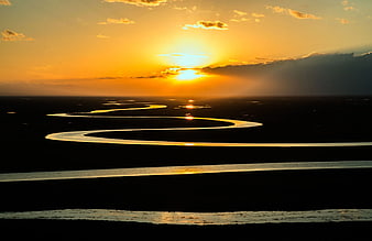 Golden Sunset Over Winding River Landscape