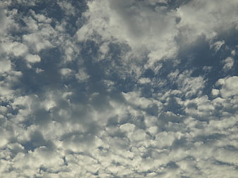 Dramatic altocumulus clouds texture in blue sky