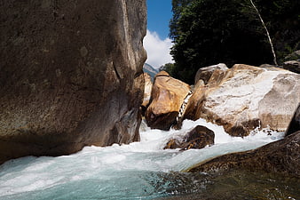 Turquoise river flowing through rocky gorge in Verzasca Valley