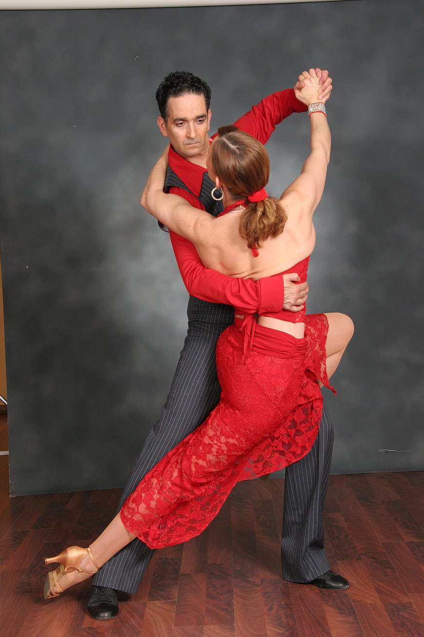 Passionate Latin Dance Couple in Red and Black Studio