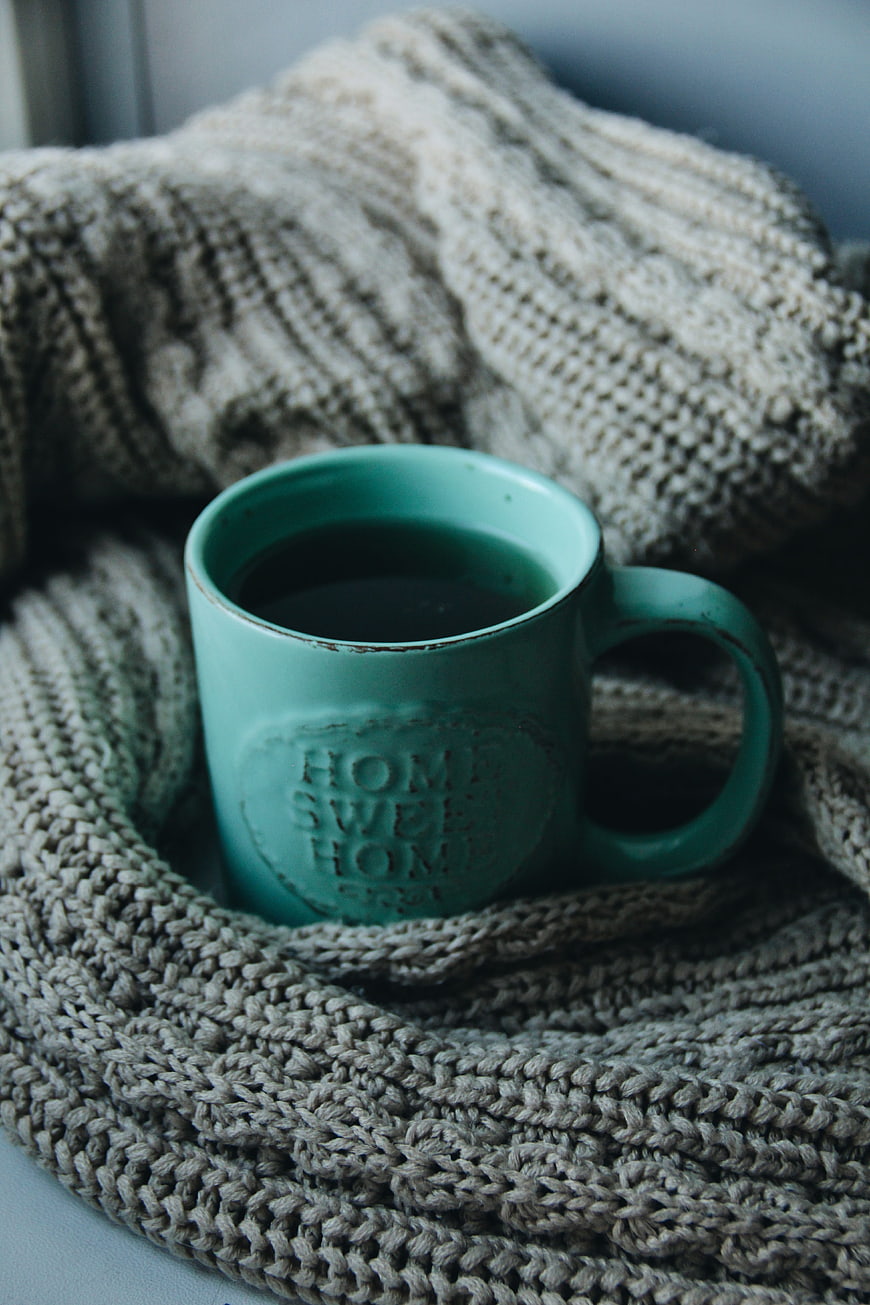 Cozy Teal Coffee Mug on Knitted Wool Blanket