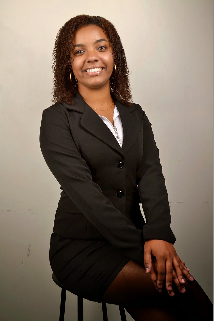 Professional Portrait of Smiling Businesswoman in Black Suit