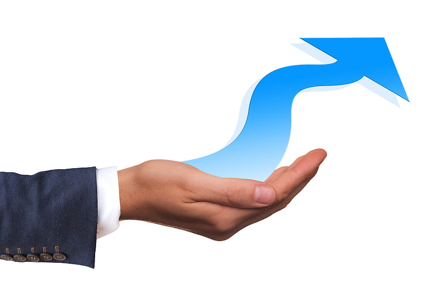 Businessman hand holding blue growth arrow on white background