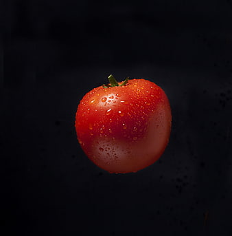 Fresh Red Tomato with Water Droplets on Dark Background
