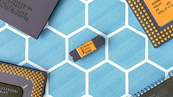 Vintage Intel 8008 Microprocessors on Blue Hexagonal Background
