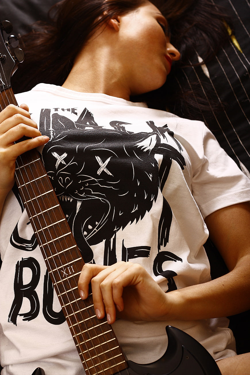 Woman with Electric Guitar and Wolf Graphic Tee