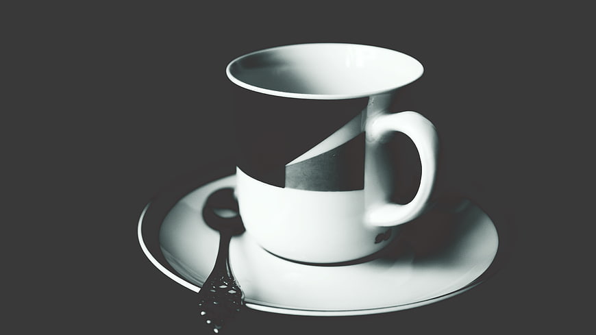 Surreal Black and White Coffee Cup with Melting Effect