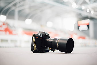Professional DSLR Camera with Telephoto Lens on Stadium Track