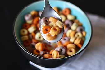 Colorful Fruit Loops Cereal Bowl with Spoon and Milk