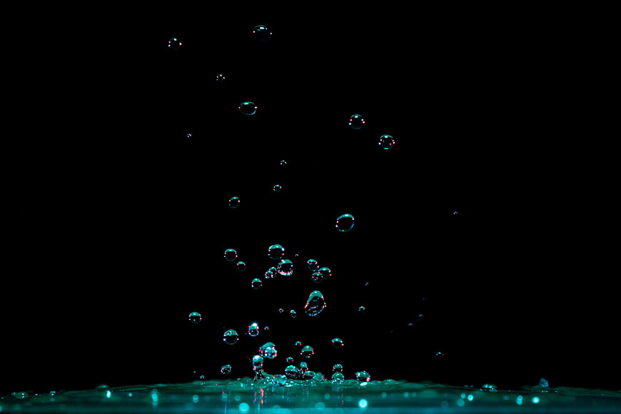 Water Droplets Splashing on Black Background