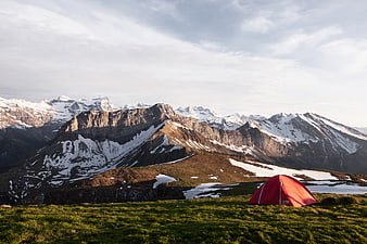 Red Tent Camping in Snowy Mountain Landscape