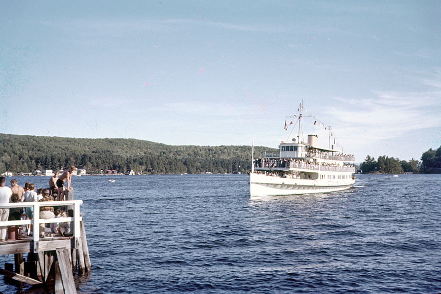 Vintage Photo of Tourist Boat on Lake with Dock