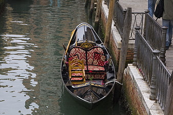 Traditional Venetian Gondola Moored in Canal