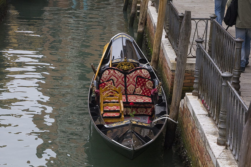 Traditional Venetian Gondola Moored in Canal