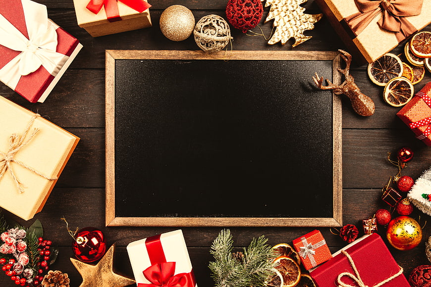 Christmas Flat Lay with Gifts, Decorations, and Chalkboard Copyspace