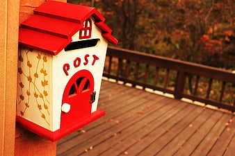 Red Cottage Mailbox On Wooden Deck