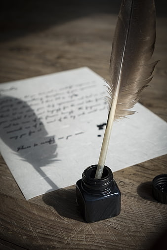 Vintage Quill Pen and Inkwell on Handwritten Letter
