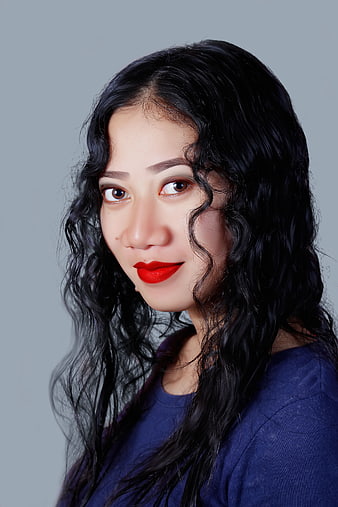 Portrait of Asian Woman with Red Lipstick and Wavy Hair