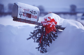 Snowy Mailbox with Christmas Decorations and Red Bow