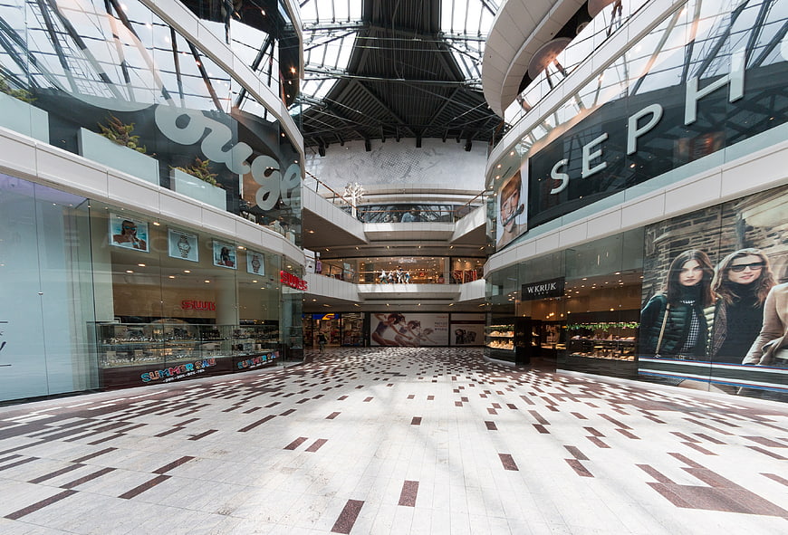 Interior View of Modern Shopping Mall Atrium with Sephora and Swarovski Stores