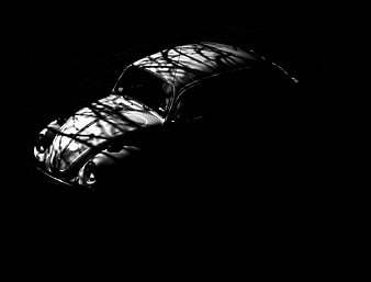 Vintage Volkswagen Beetle in dramatic black and white lighting