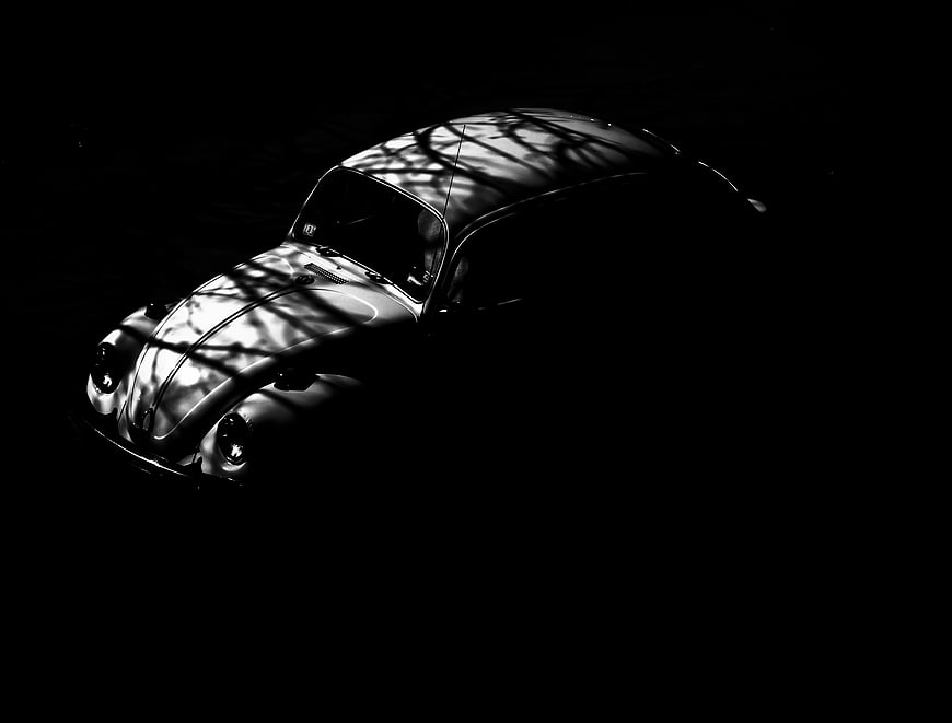 Vintage Volkswagen Beetle in dramatic black and white lighting