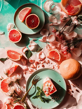 Flat Lay Grapefruit Dessert with Pink Flowers and Mint