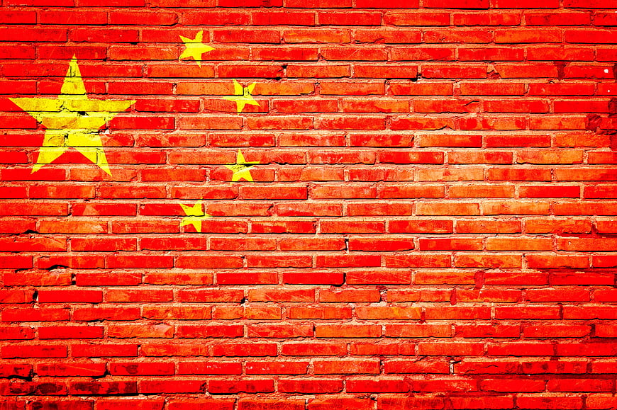Chinese Flag Graffiti on Red Brick Wall Background