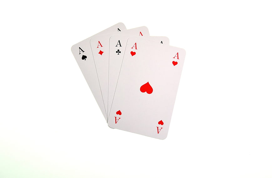 Four Aces Playing Cards Fanned on White Background